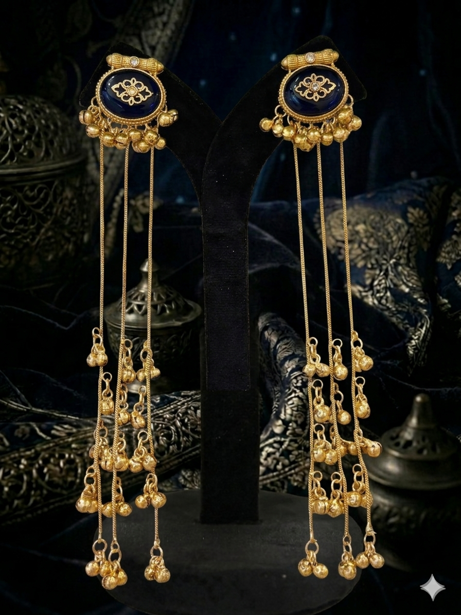 gold earrings with blue center