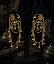 gold earrings with intricate designs