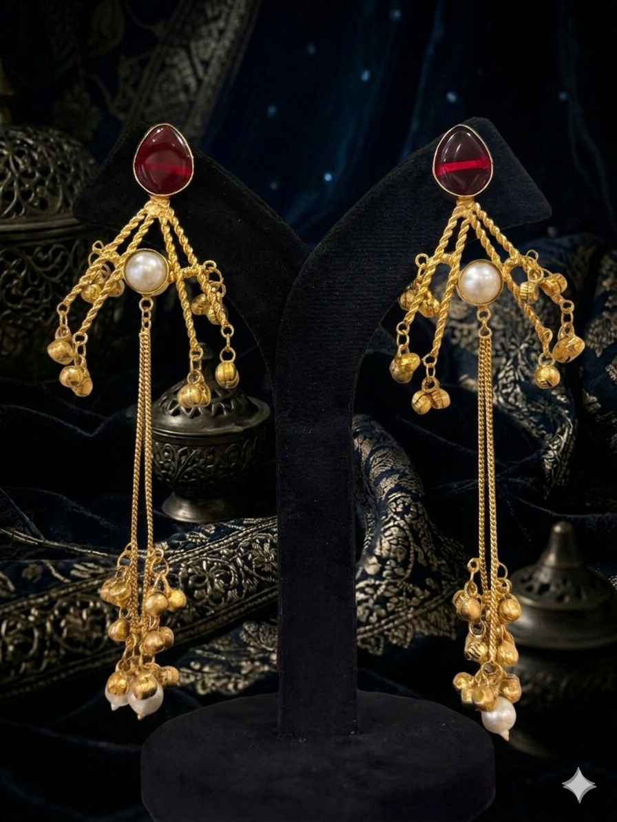 Gold earrings with red gemstones