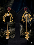 Gold earrings with red gemstones