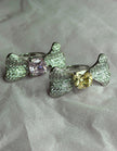 Two silver bow-shaped rings 