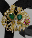 Ornate gold earrings with green gemstones 
