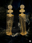 gold earrings with intricate designs
