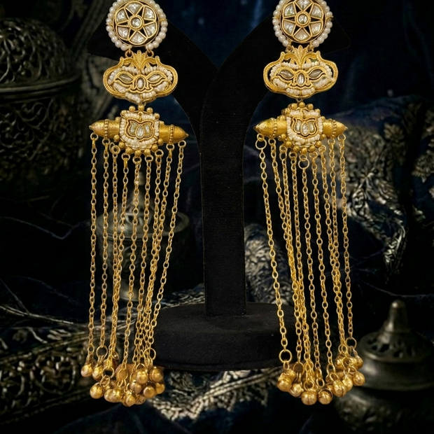 gold earrings with intricate designs