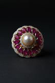 Decorative ring with pearls and red stones 