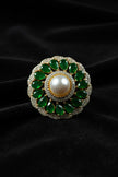 Decorative ring with green gemstones 