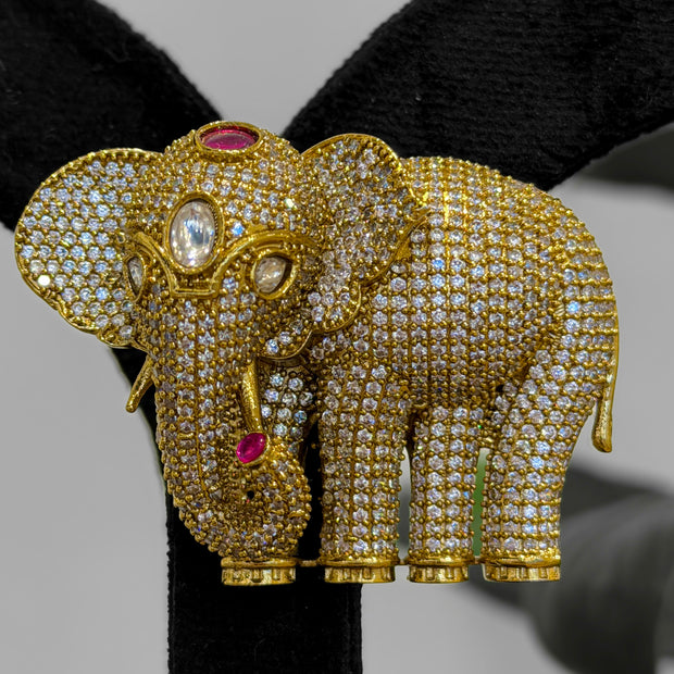 Gold elephant brooch with gemstones 