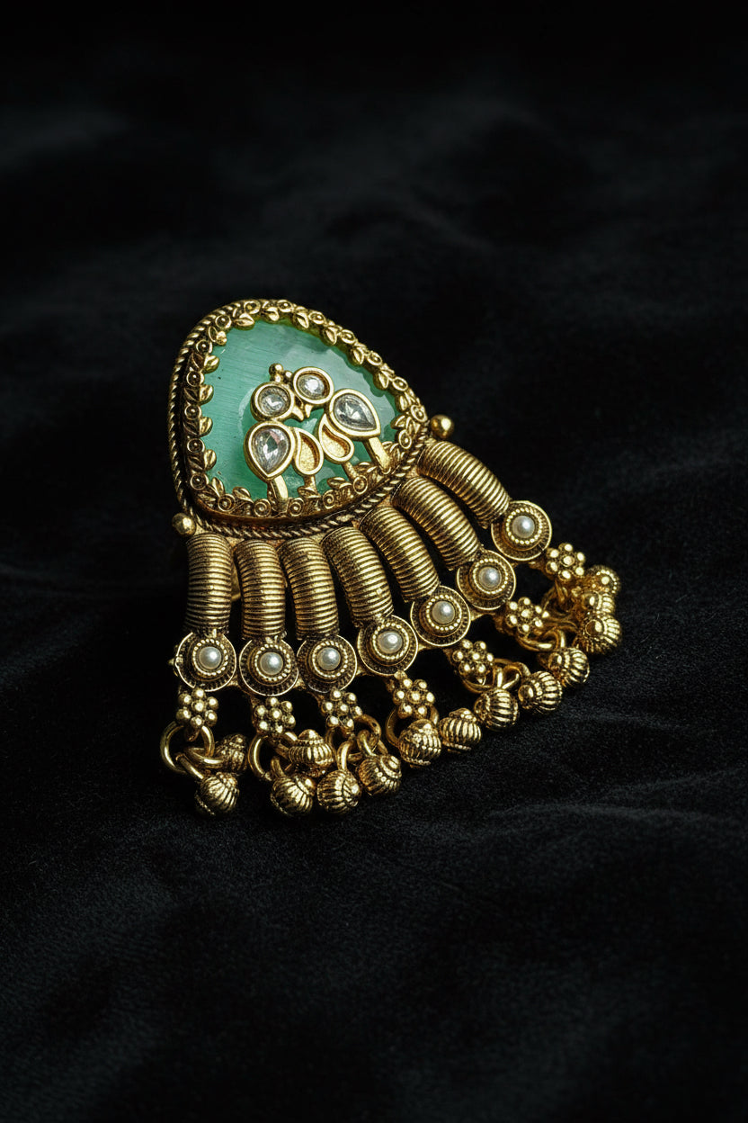 ring with gold and green design