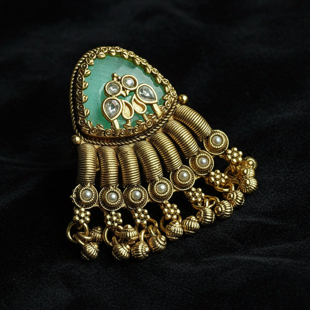 ring with gold and green design
