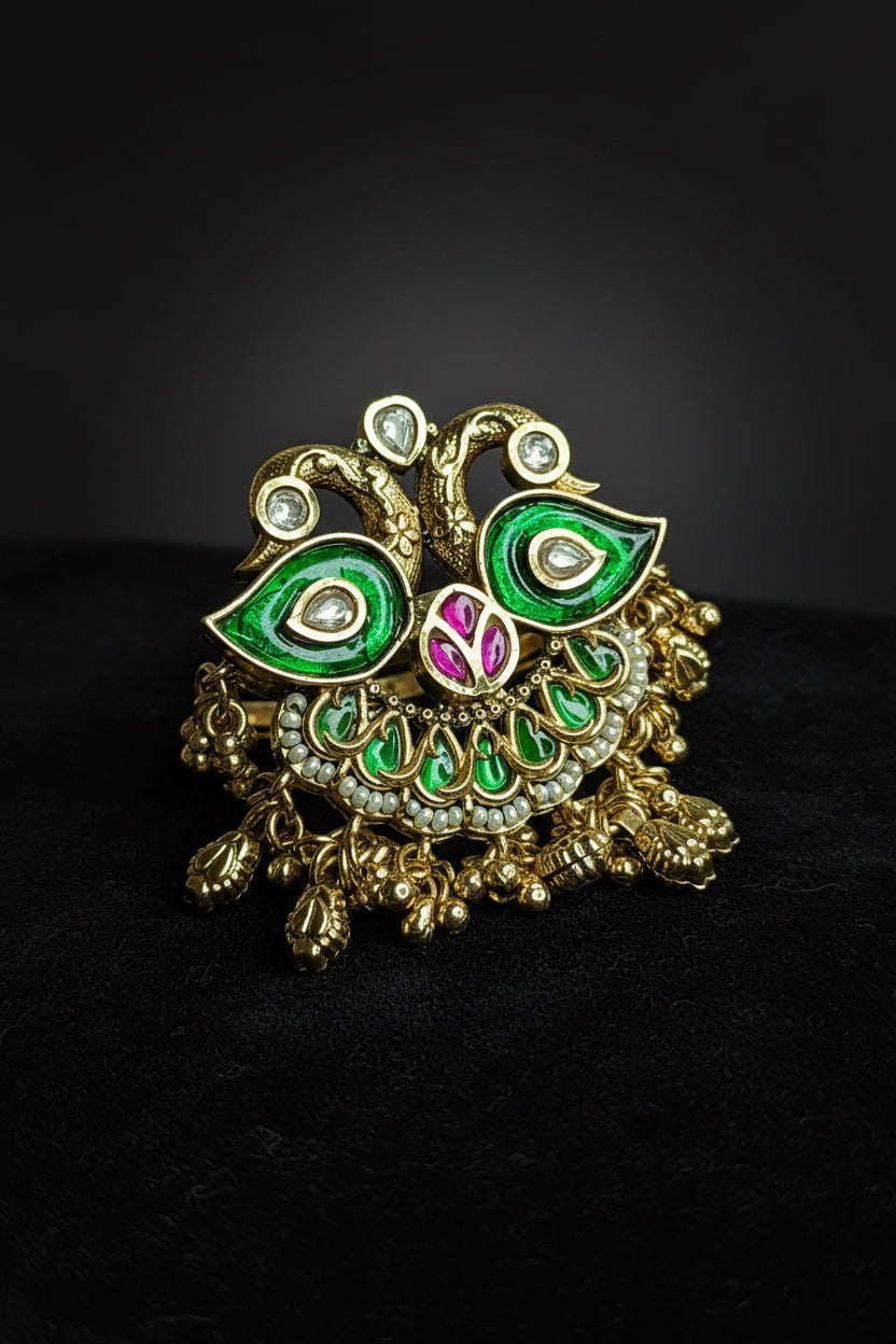  peacock-shaped brooch with green and gold colors 