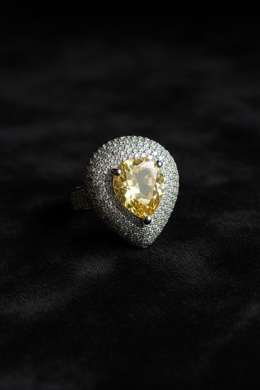 Ring with a yellow gemstone and diamond