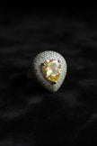 Ring with a yellow gemstone and diamond
