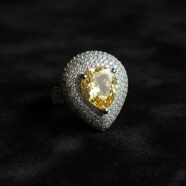 Ring with a yellow gemstone and diamond