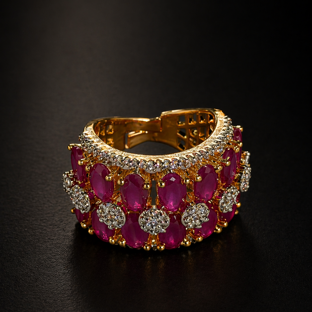 Gold bracelet with red gemstones