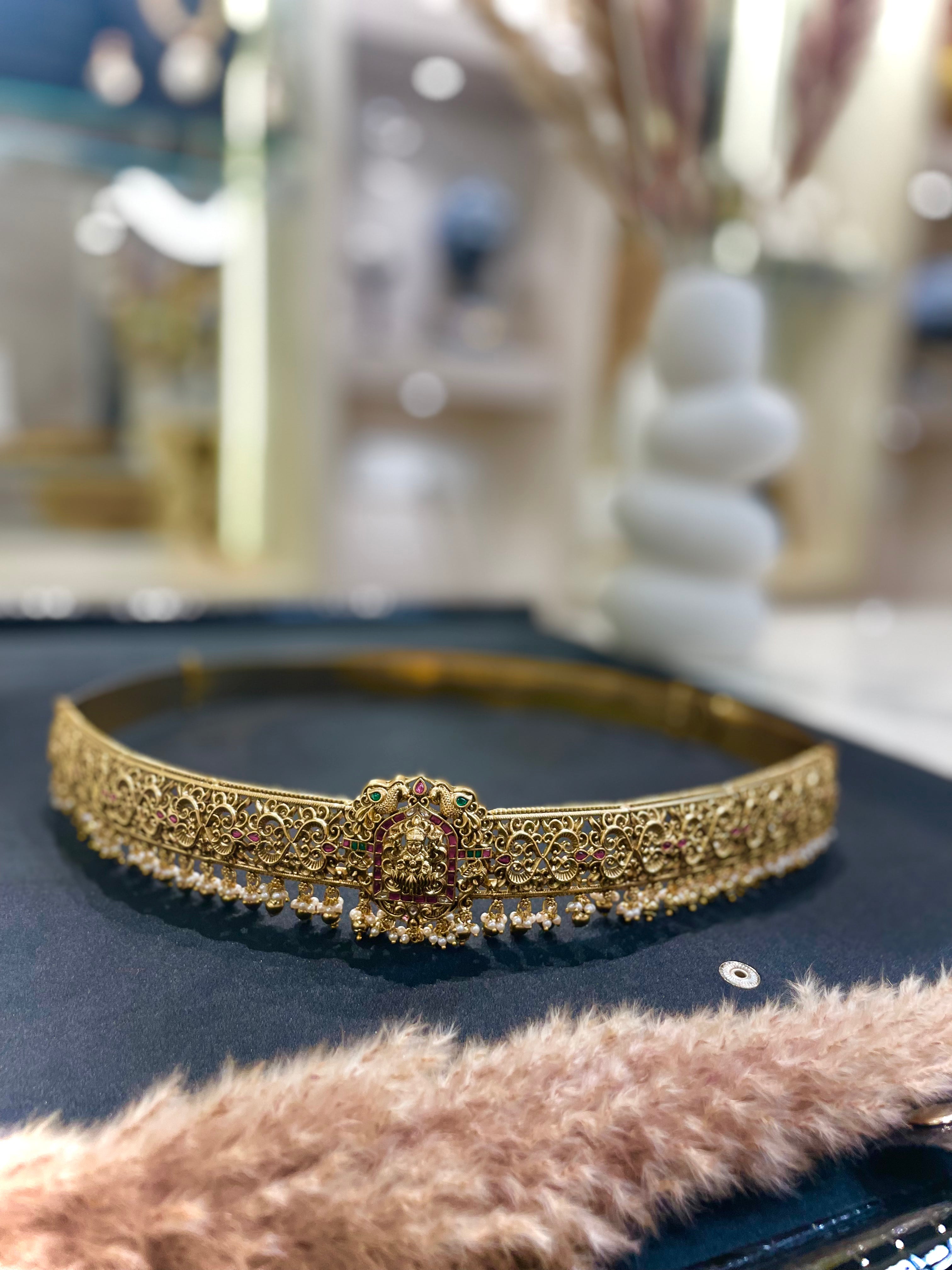 Gold headband with intricate design 