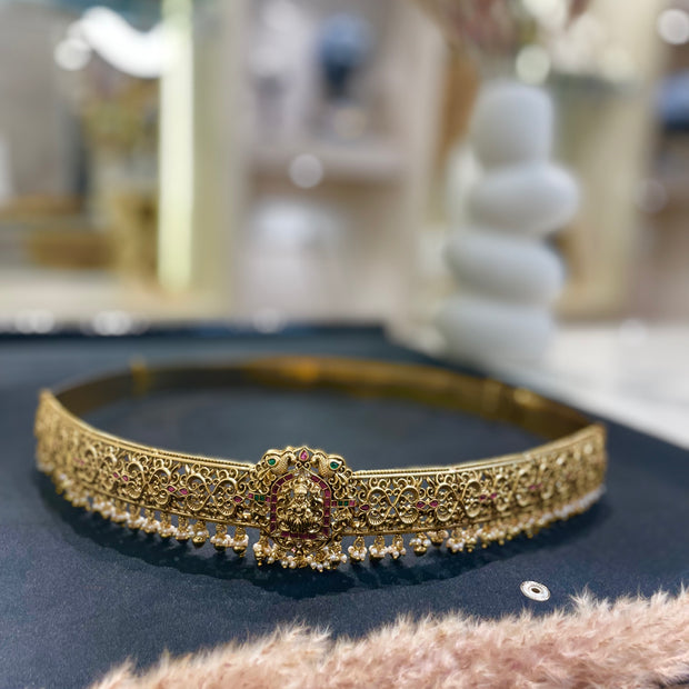 Gold headband with intricate design 