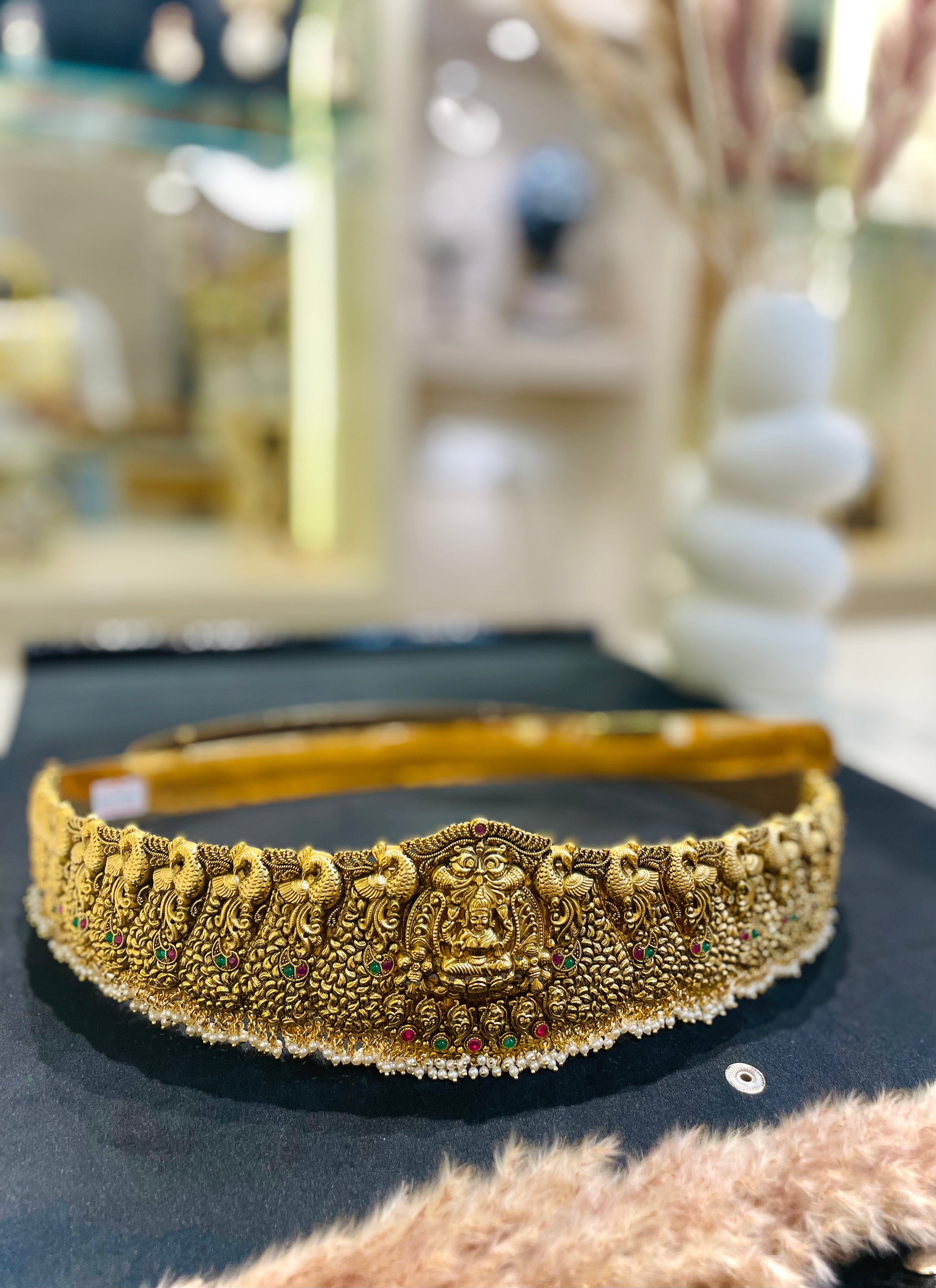 Decorative gold headband with intricate designs 