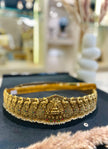 Decorative gold headband with intricate designs 
