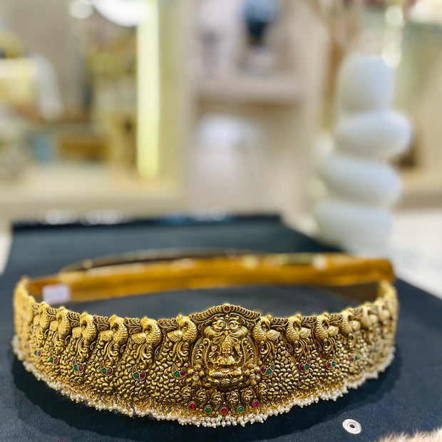 Decorative gold headband with intricate designs 