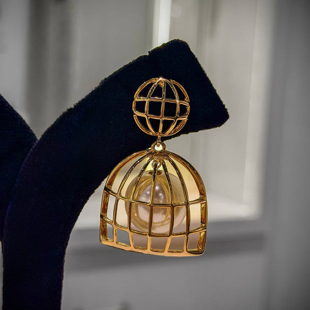 Gold cage earring with pearl center 