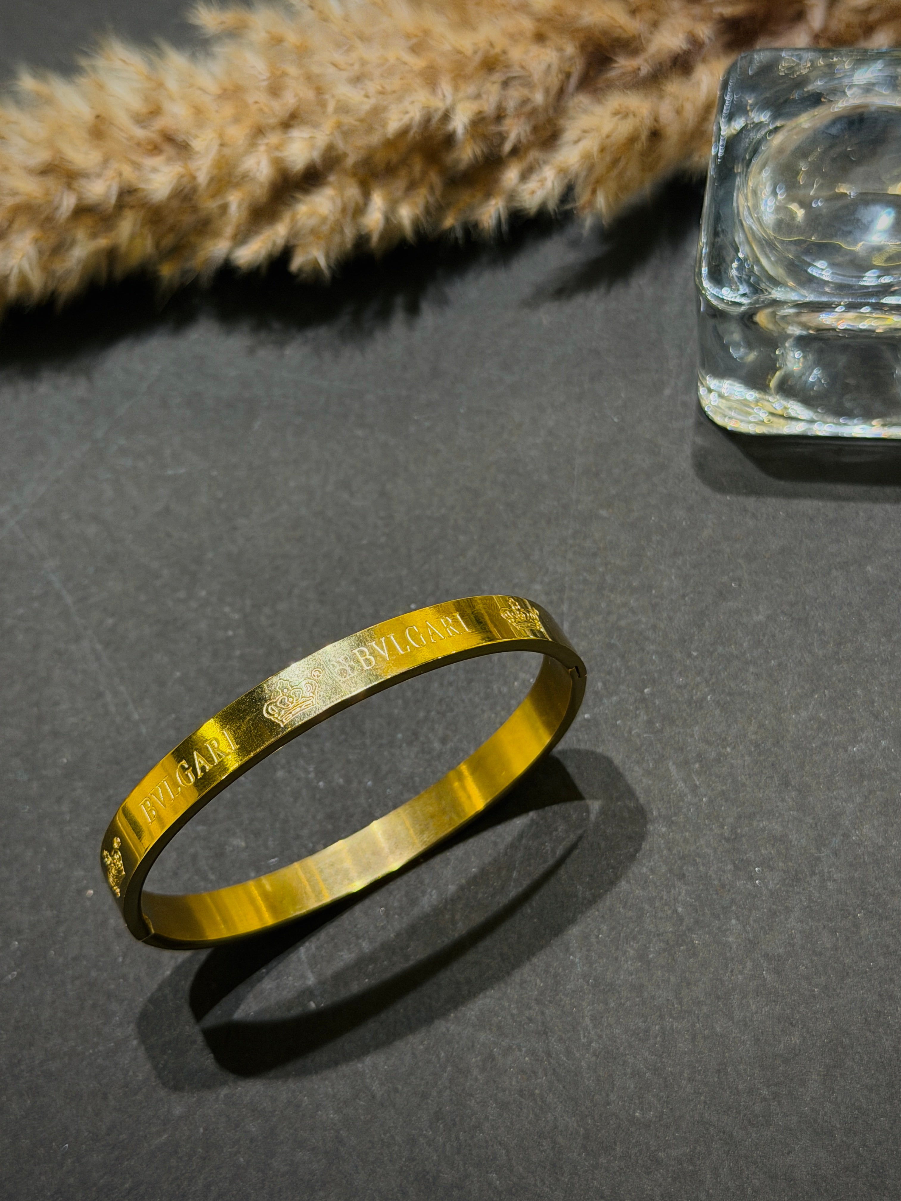 Gold bracelet with engraved text 
