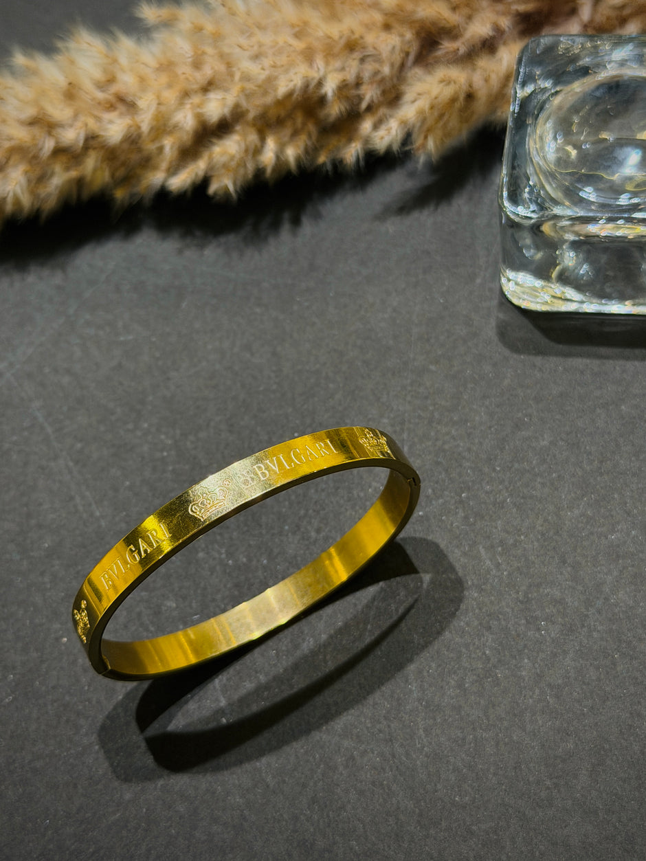 Gold bracelet with engraved text 