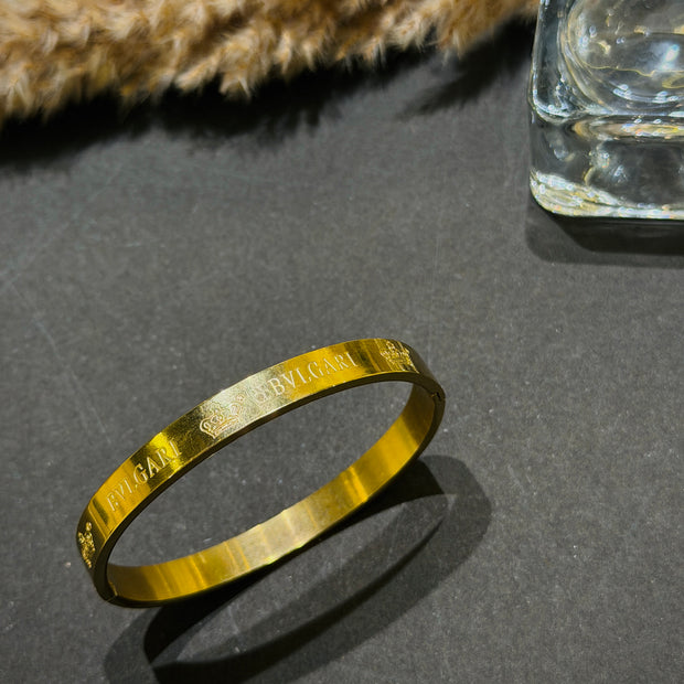 Gold bracelet with engraved text 