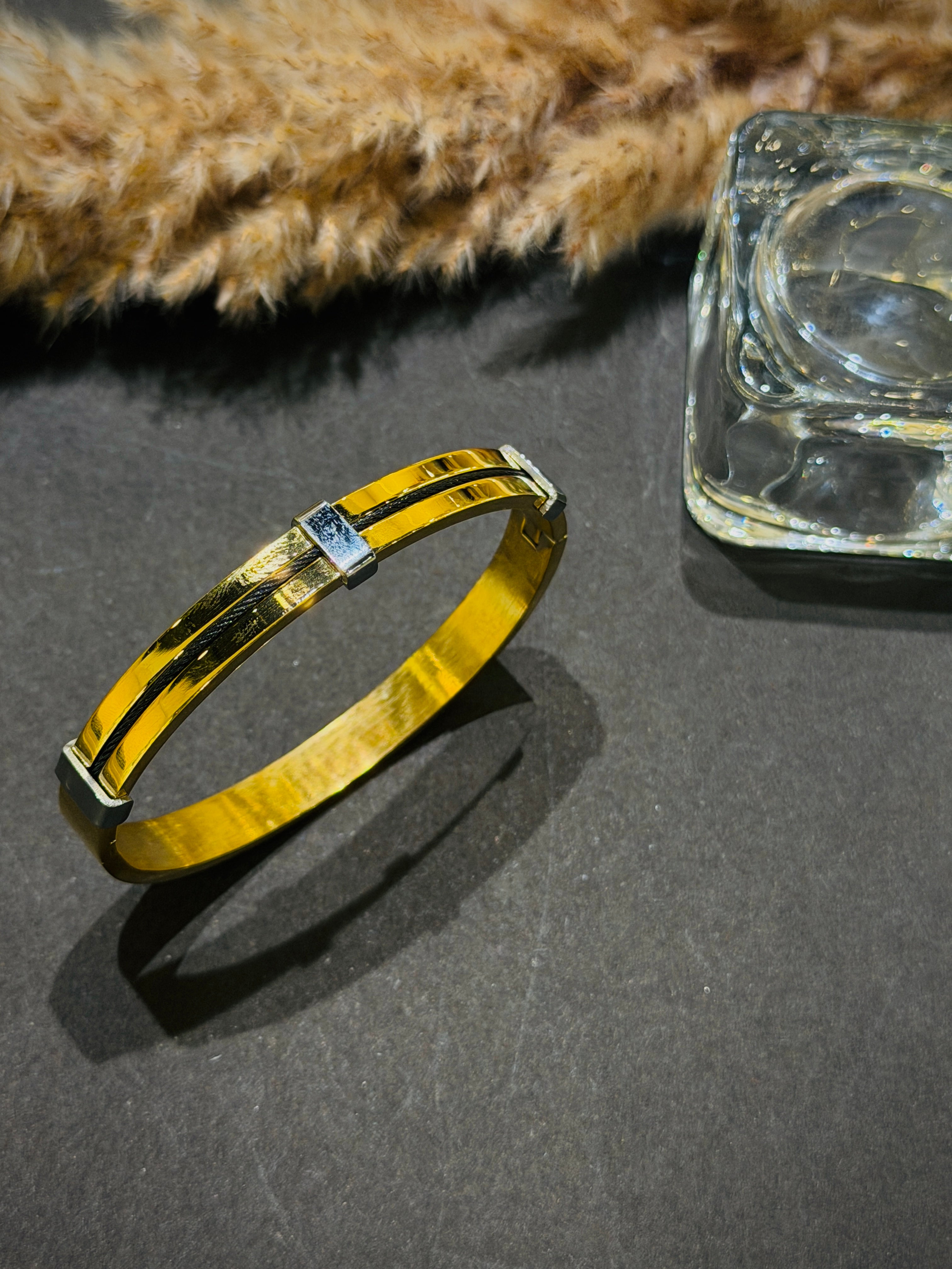 Gold bracelet with a clear stone 