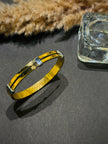 Gold bracelet with a clear stone 