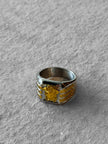 Silver ring with a yellow gemstone 