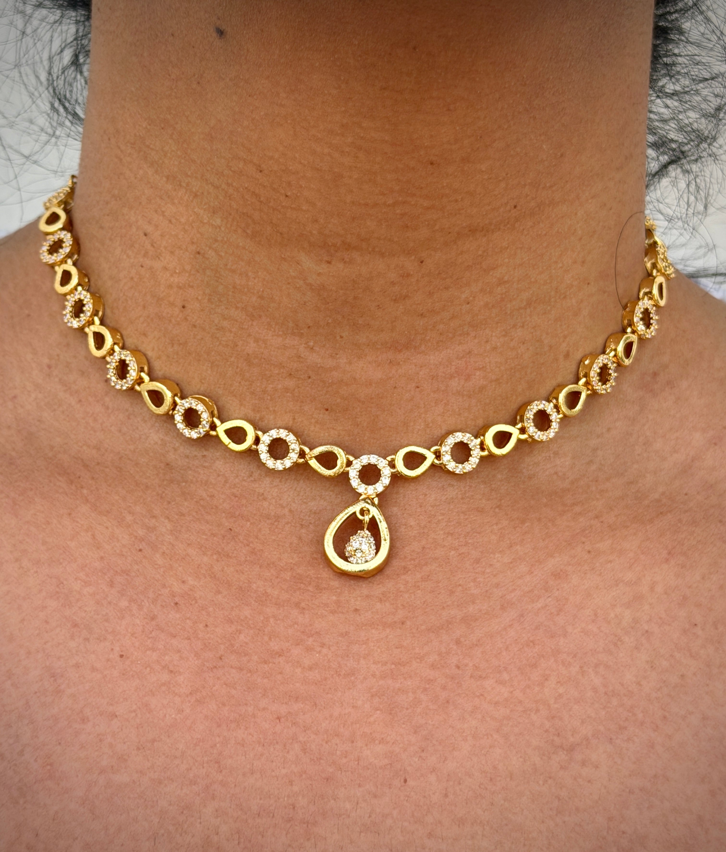 Gold necklace with a pendant 