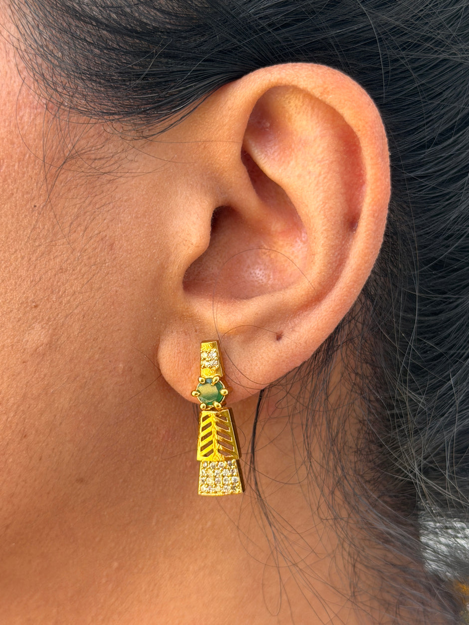 Gold earring with green gemstone 