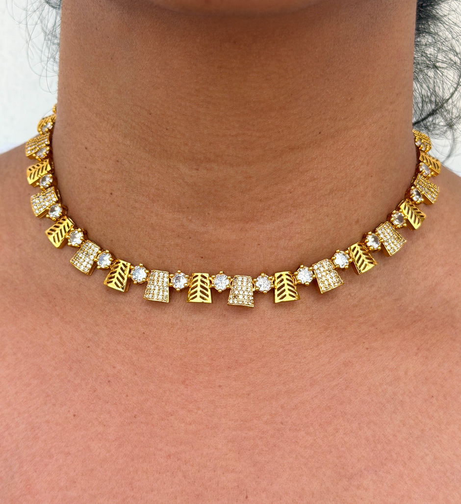 Gold necklace with geometric designs 