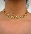 Gold necklace with leaf design 
