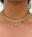 Gold necklace with white stone