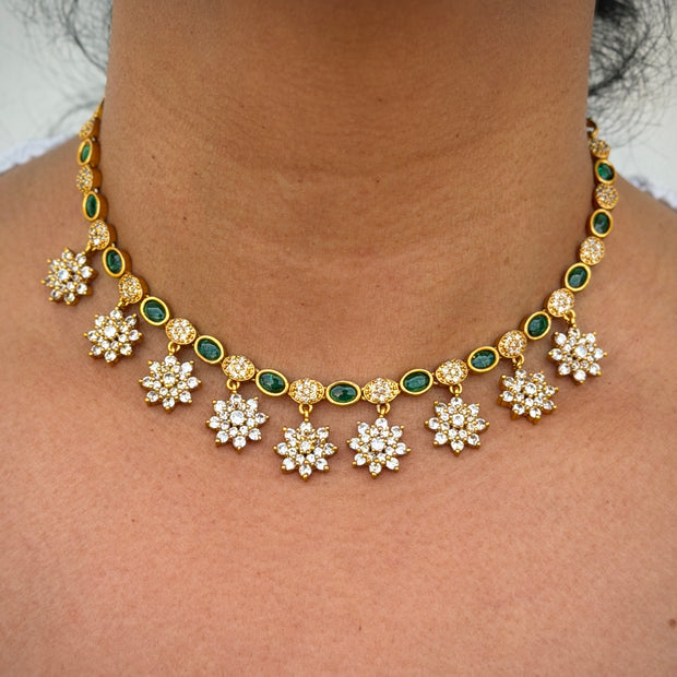 Gold necklace with floral designs 