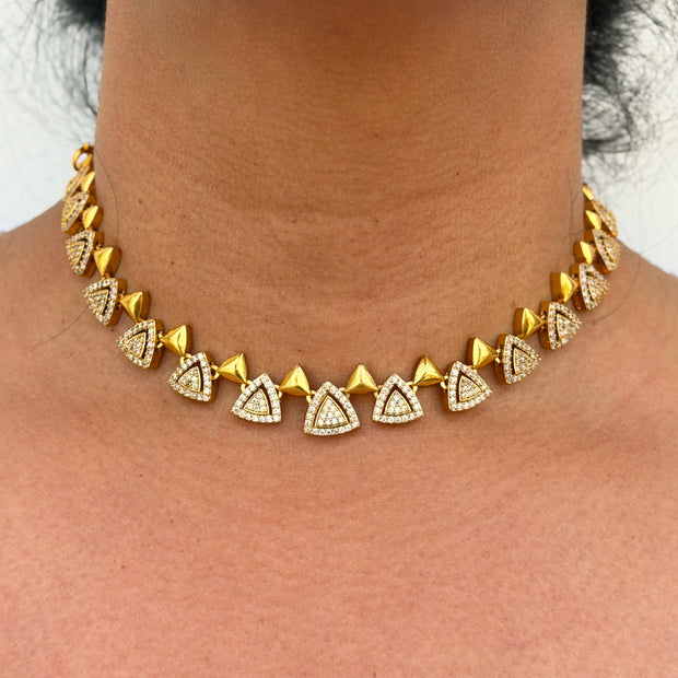 gold neklace with white stone