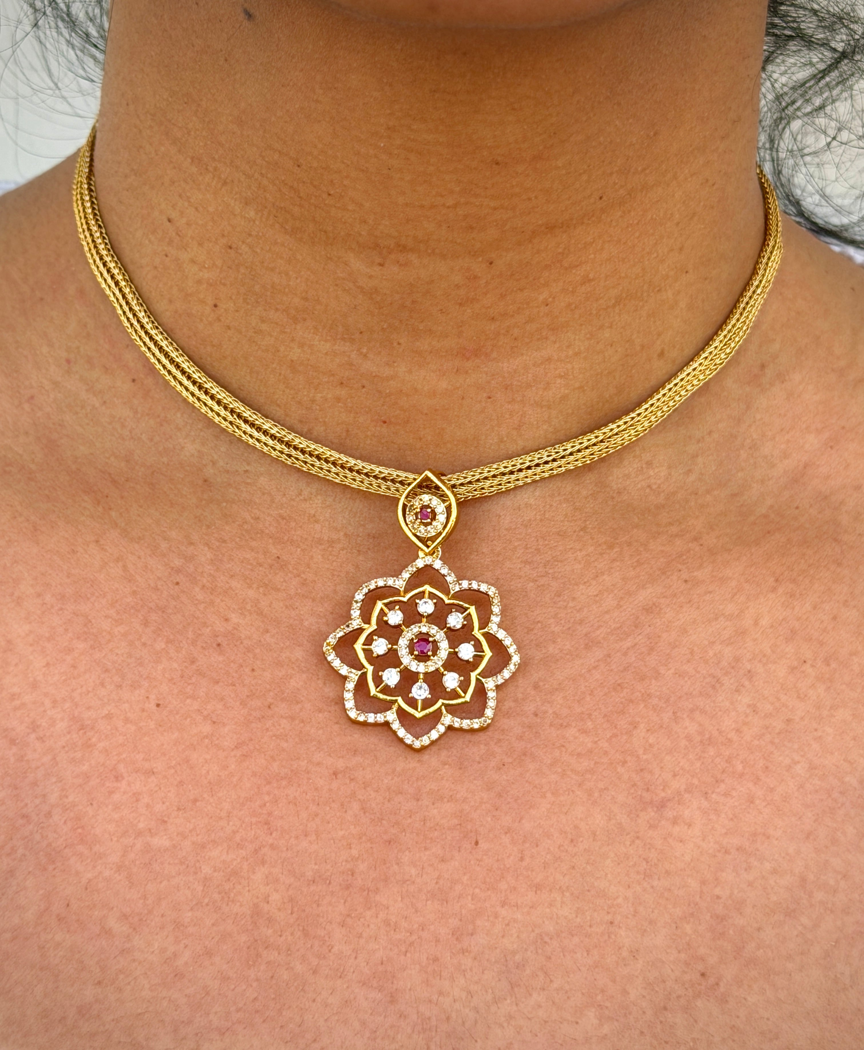 gold neklace with pink stone