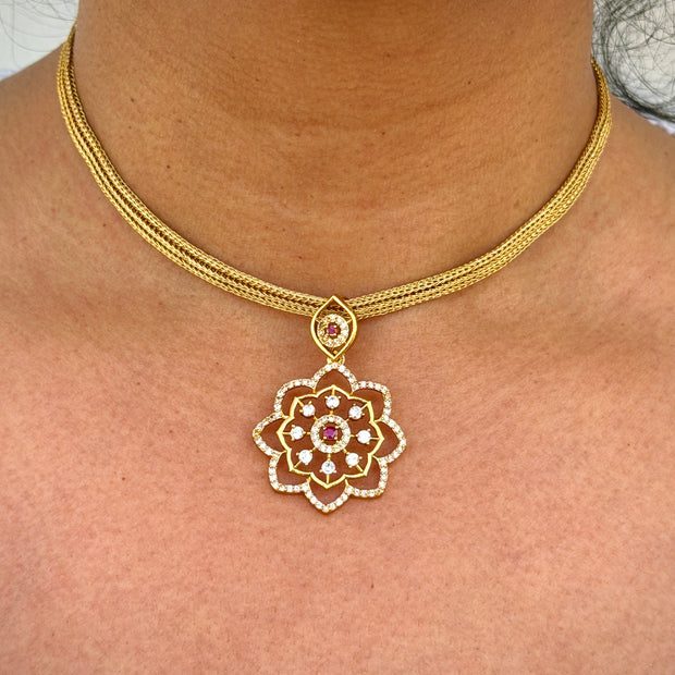 gold neklace with pink stone