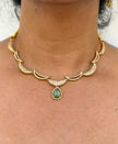 gold neklace with green stone