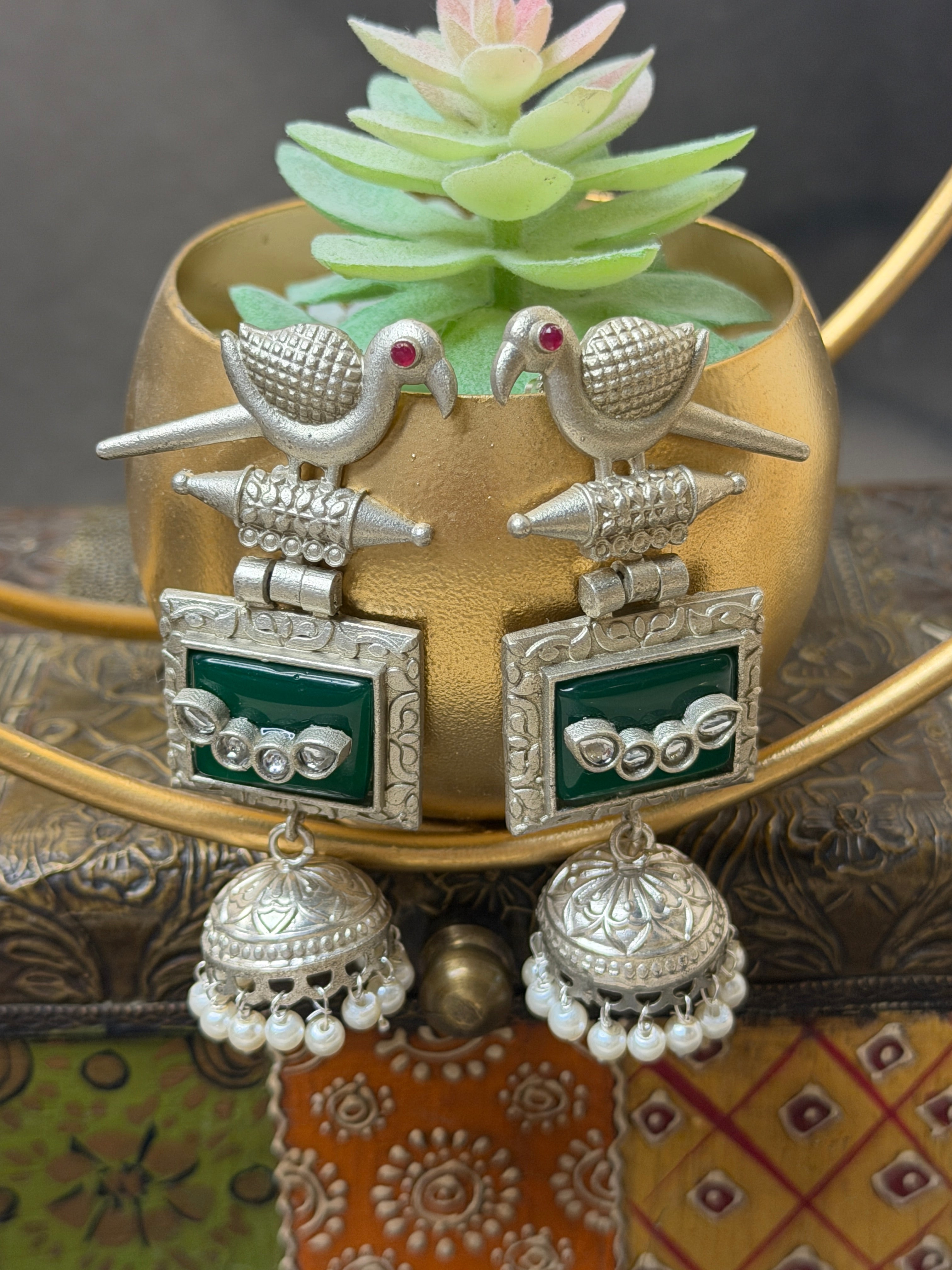 Silver jewelry with green stones 