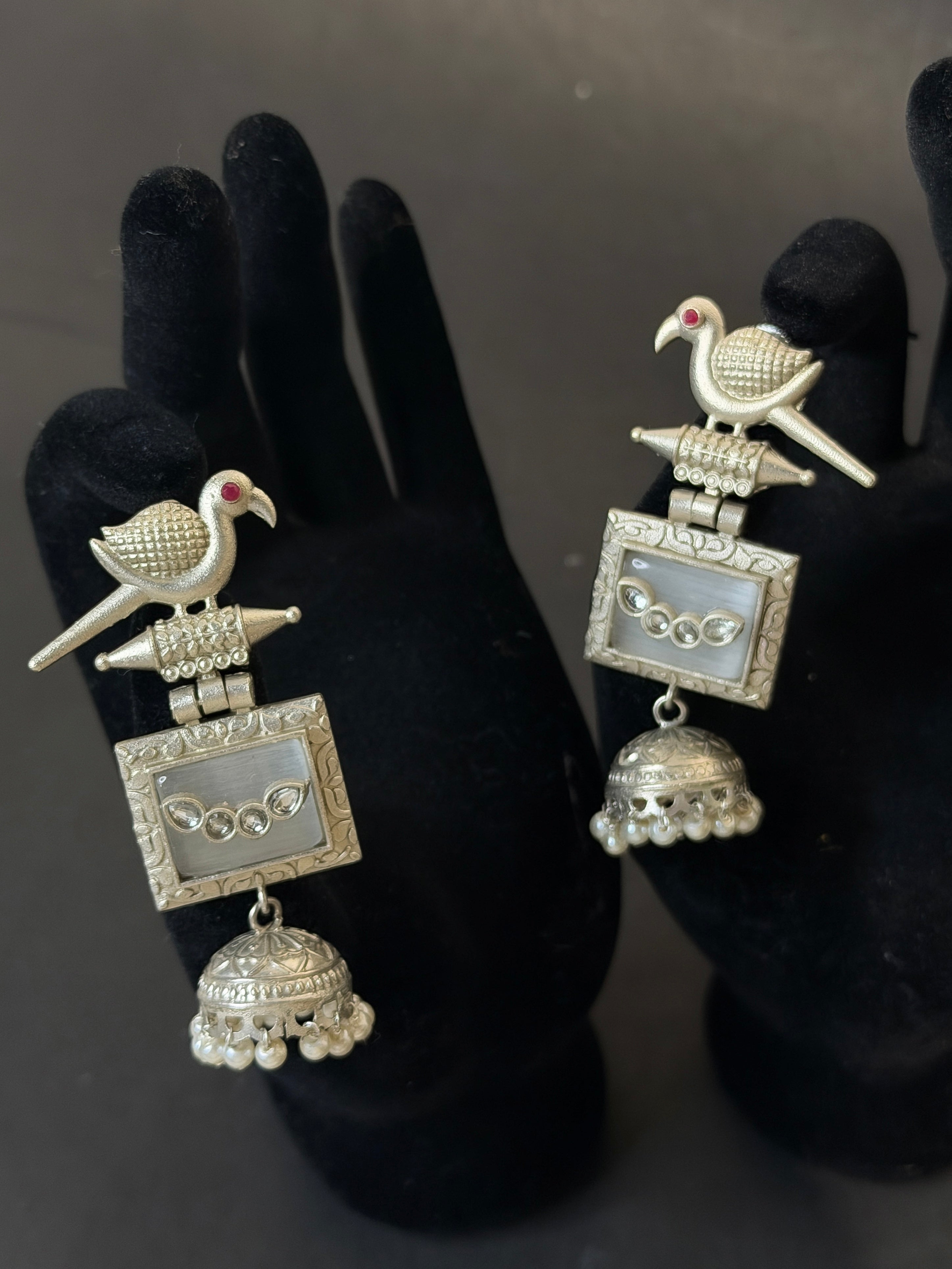 Silver earrings with bird design