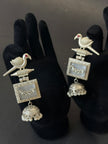 Silver earrings with bird design