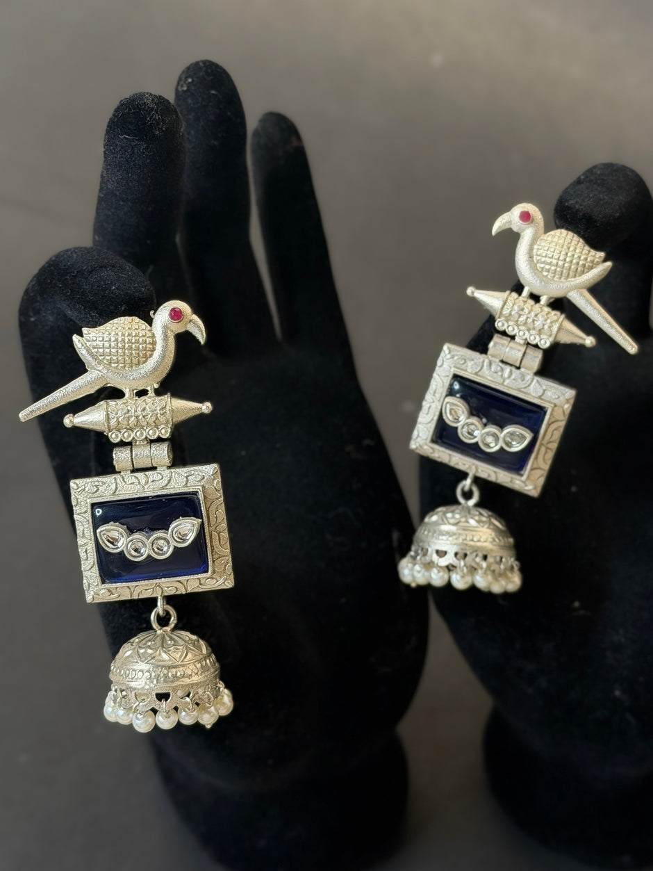 Silver earrings with bird design