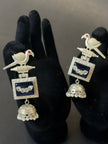 Silver earrings with bird design