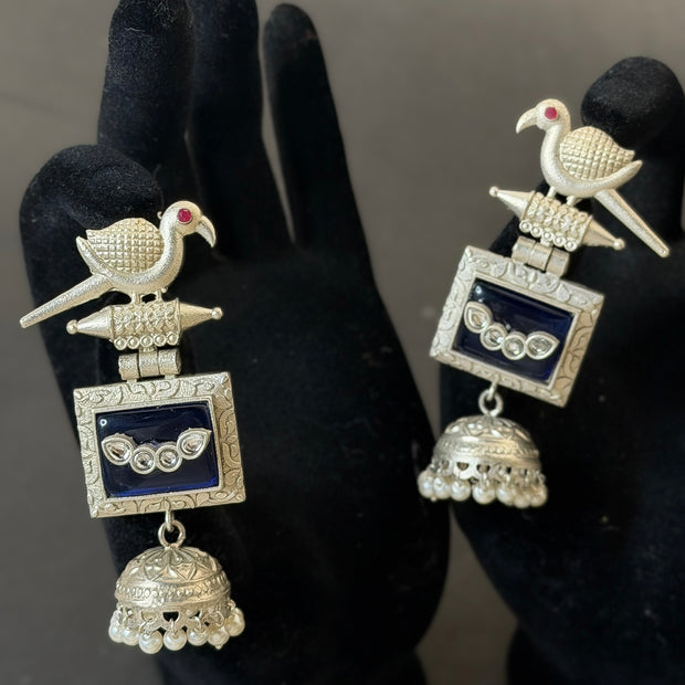 Silver earrings with bird design