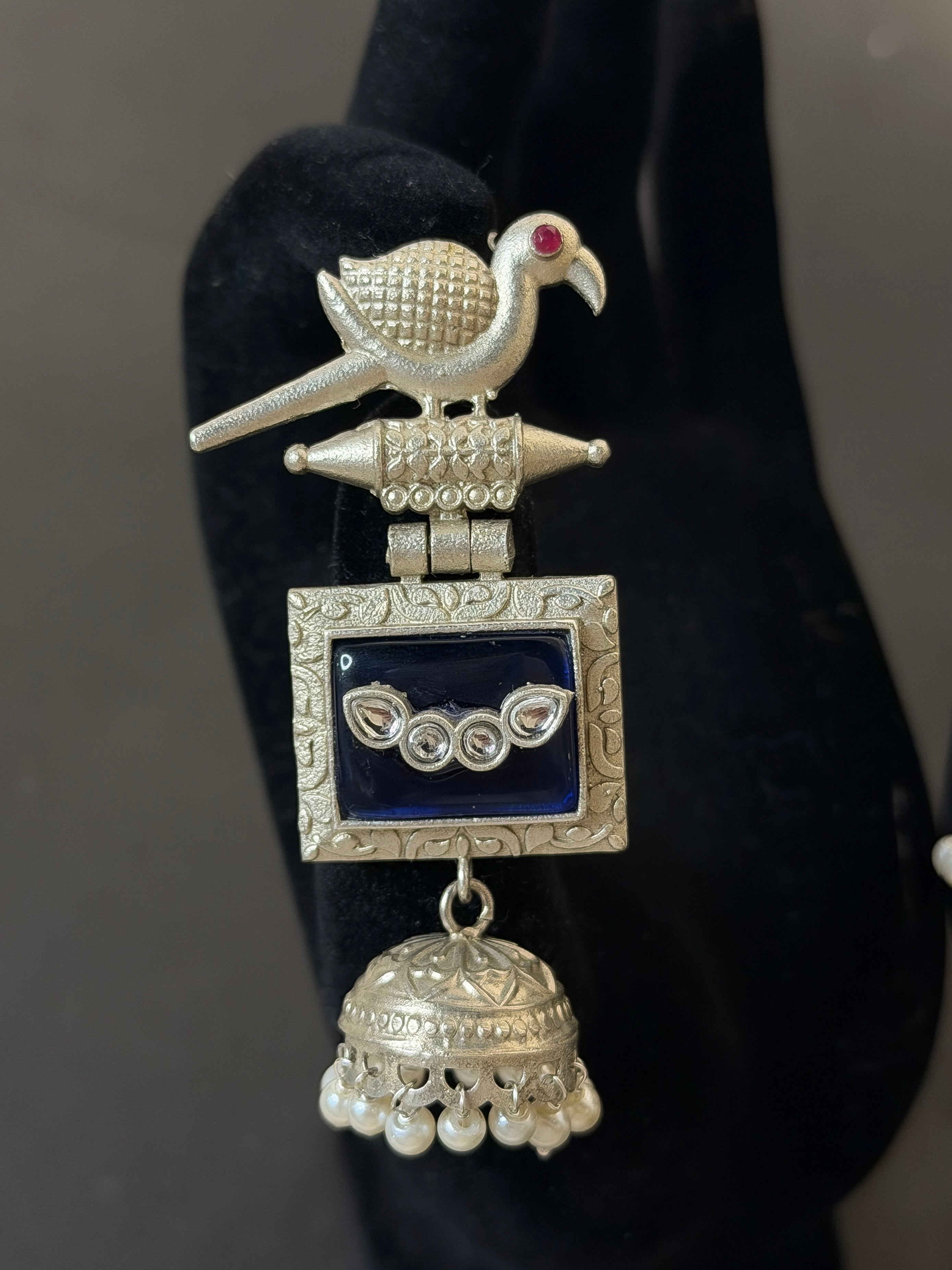 Decorative silver brooch with a bird design