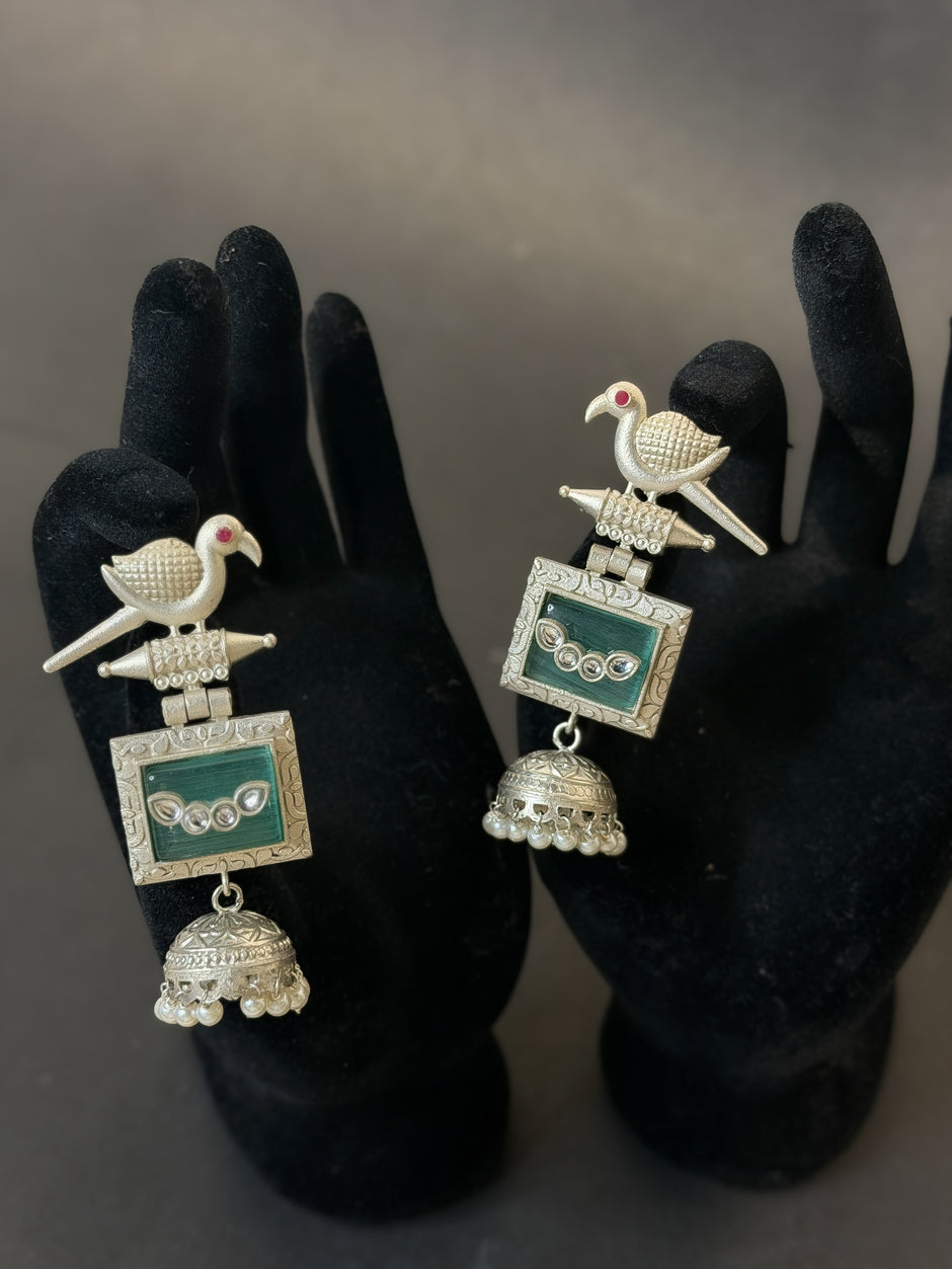 Ornate earrings with bird design