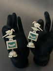 Ornate earrings with bird design