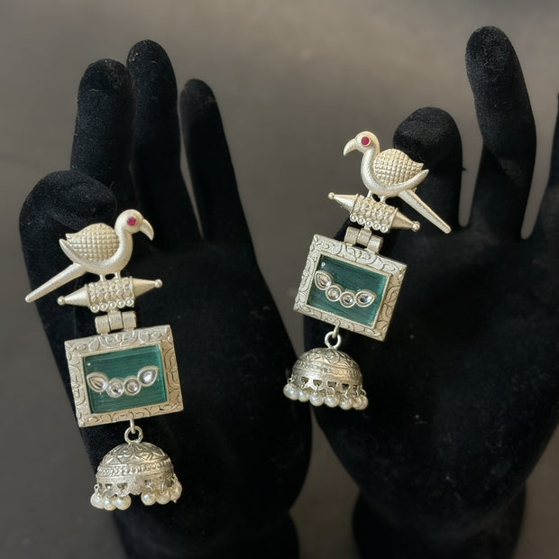Ornate earrings with bird design